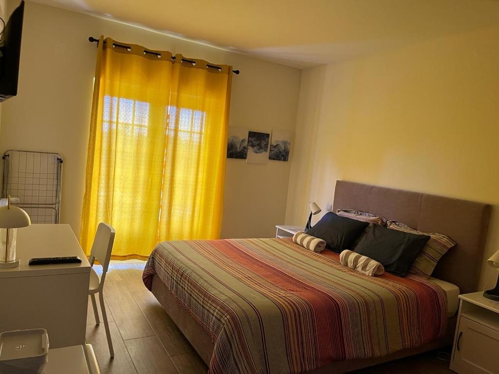 Guest bedroom with warm light and double bed